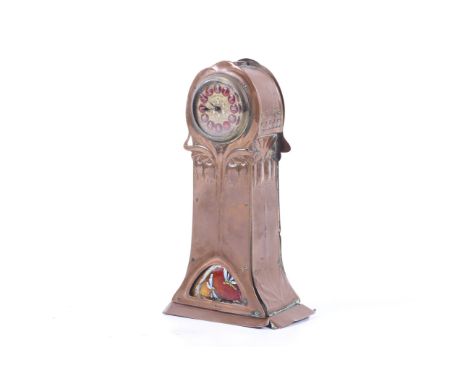 An Arts and Crafts mantel clock. The copper work case with enamel details and a bluebell motif to the front and sides. With a