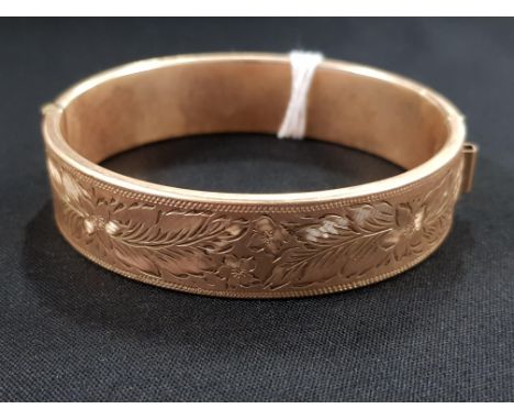 9 CARAT GOLD BANGLE WITH METAL CORE