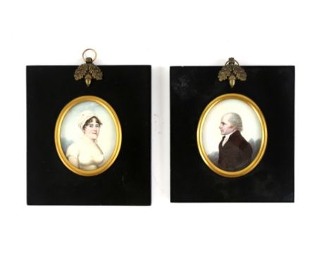 Pair of 19th century oval portrait miniatures depicting a gentleman in a black coat and a lady in a white dress and head scar