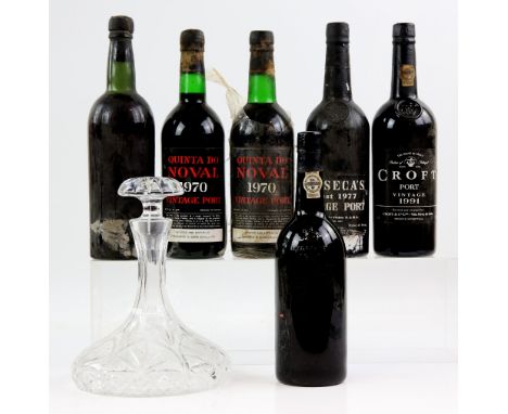 Six bottles of port to include: one bottle of Warre's 1977 vintage (lacking label), two bottles of Quinta Do Noval 1970 vinta