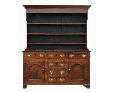 18th century oak dresser with three tier plate rack above three drawers, three further central drawers flanked by panelled cu