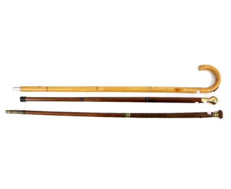 Cane walking stick enclosing a combined meter rule, spirit level and set square, 94cm long, hardwood and brass three section 