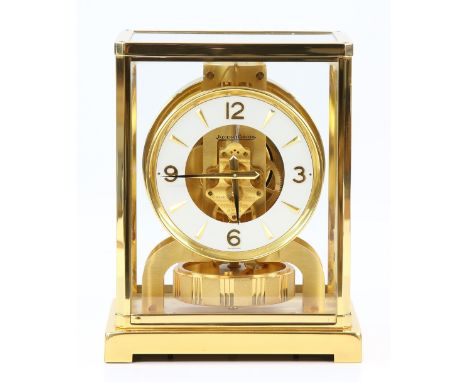 Jaeger-LeCoultre 'Atmos' clock, with a brass case with five glazed panels and a white circular dial, with dagger and Arabic n