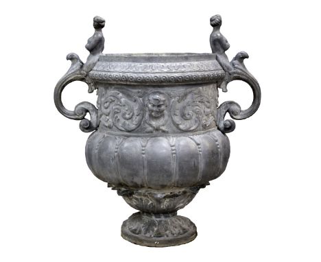 19th century lead planter, the baluster body decorated with cherubs and acanthus leaves, with twin scrolling figural handles,