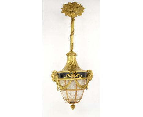 Early 20th century gilt metal hall lantern mounted with goats masks and a crackled ice glass shade 73cm.     .     