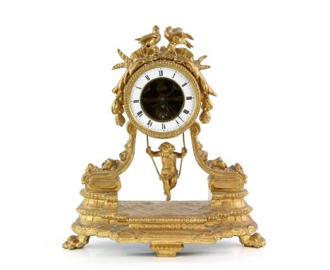 French gilt spelter mantle clock with swinging cherub pendulum and giltwood stand, 32cm.     .     