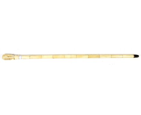 Early 20th century bone walking stick, the handle in the form of a Chinese style horse, 86cm long,.     .     