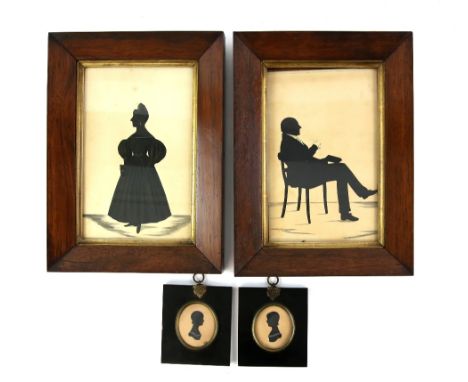 Pair of 19th century oval portrait silhouettes, each 6cm x 7cm,  and two silhouettes of a man and a woman, each 26cm x 17cm (