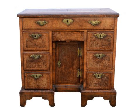 18th century walnut kneehole desk with herringbone cross-banding, with long single drawer, central short drawer over cupboard