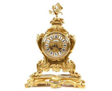 French gilt metal mantel clock, the dial with enamelled cartouches and Roman numerals, twin train movement, by Philippe Ft, 6