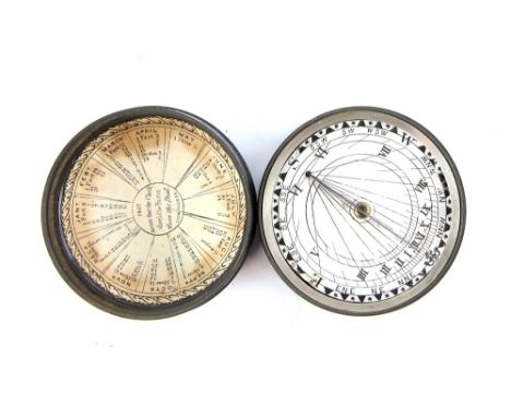 19th century magnetic pocket sundial having printed card dial with Roman numerals and a central brass gnomon, the interior of