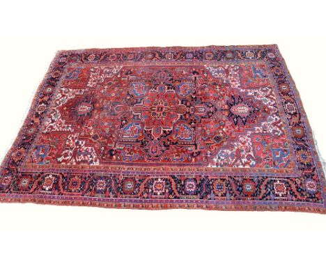 Heriz red ground carpet 357cm x 268cm .     .     