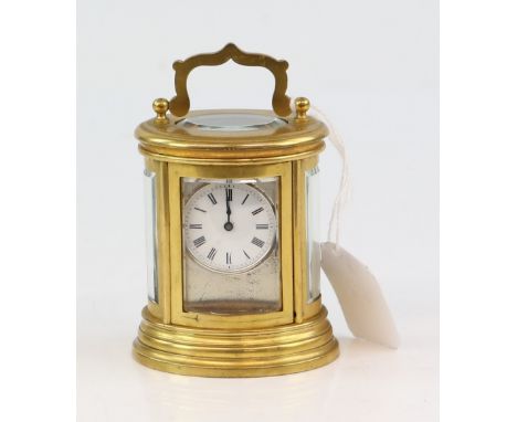 19th century bras and glass oval carriage clock with barrel movement, 10cm  .     .     