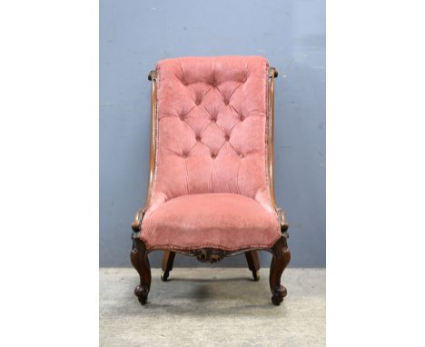 19th century mahogany farmed button back nursing chair on carved legs .     .     