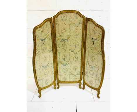 19th Century three fold gilt framed silk screen decorated with flowers and birds behind glass; centre panel, 45 x 130cms; sid