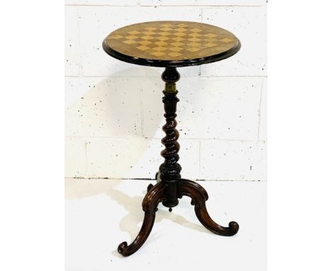 Mahogany chequerboard top wine table on spiral turned pedestal to three carved feet, 43 x 71cms. Estimate £30-50.