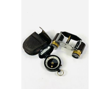 Negretti and Zambra compass in ebonised case with original leather pouch marked Negretti and Zambra; together with a pair of 