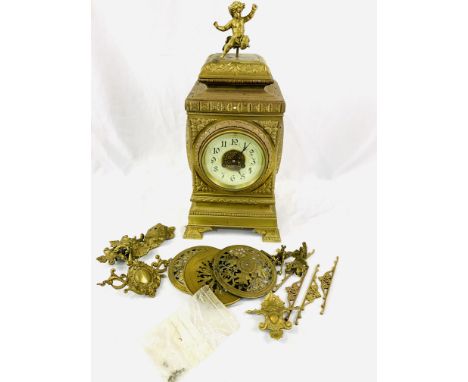 Large very ornate French brass cased mantel clock with movement by D.C. Co, requires putting back together. Estimate £50-70.