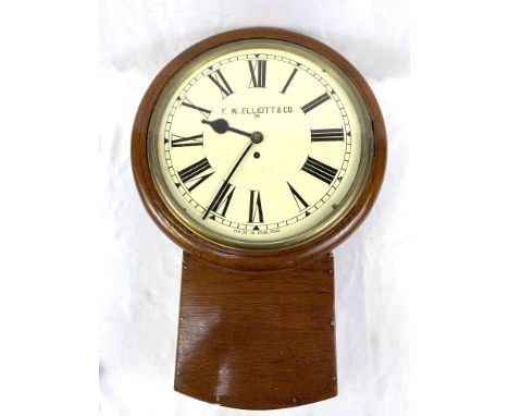 Mahogany framed drop dial wall clock, marked to face F W Elliott &amp; Co, in going order, with pendulum and key, diameter of