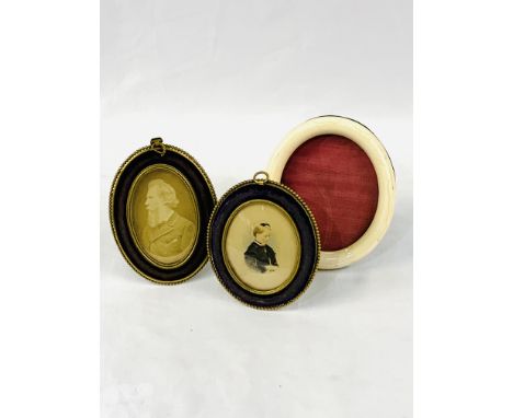 Two gilt brass and velvet small oval frames, one with a watercolour portrait of a lady; and an oval bone edged frame. Estimat