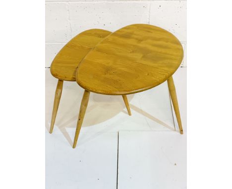 Nest of two Ercol pebble tables, top table 65 x 44 x 40. Estimate