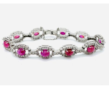 10ct white gold, ruby and diamond bracelet, length 18 cms. Estimate £2,600-3,000