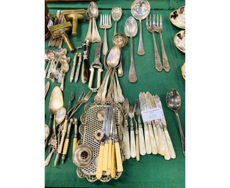 Large quantity of silver plate cutlery including: mother of pearl handled fish knives and forks; large serving spoon; large l