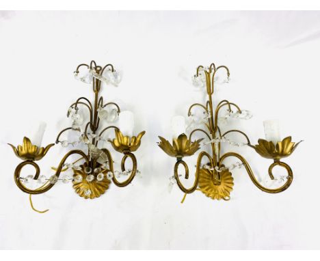 Four brass wall lights with glass droplets: three doubles, two measuring 30 x 26cms, one 40 x 25cms; and a triple light, 35 x
