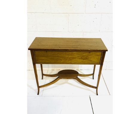 Edwardian mahogany chest on tapered legs with display shelf beneath, banded inlay to top and front, 89 x 35 x 73cms. Estimate