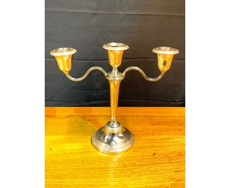 Large 3 armed sterling silver candelabra stabilised base. Estimate £150-180.