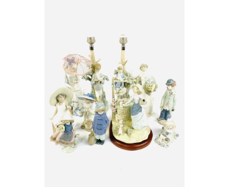 A pair of Lladro table lamps; 2 female figures; 2 Lladro clown figures; Lladro girl holding flowers figure; Medlife wishing w