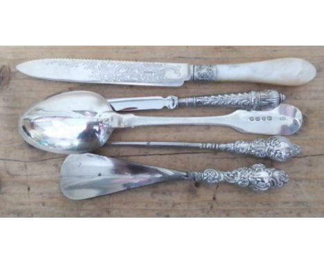 Assorted hallmarked silver comprising a mother of pearl handled knife, a large spoon, a letter opener, a shoe horn and a butt