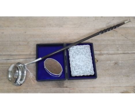 A cased hallmarked silver card case, a hallmarked silver pin cushion and a twist baleen punch ladle unmarked.Condition:- Gene
