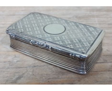 A William IV silver snuff box, engraved design to top and base, fluted sides and scroll thumb piece, gilt interior, Joseph Wi