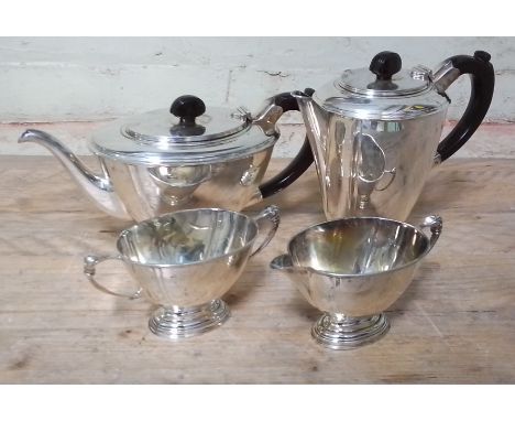 A George VI Art Deco style four piece silver tea service, bakelite handles, Henry Clifford Davis, Birmingham 1947, gross wt. 