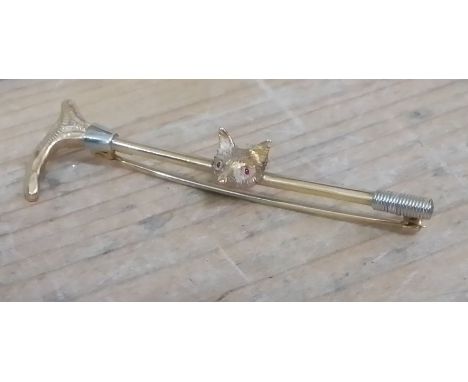 A bar brooch formed as a riding crop and fox's head, marked '9c', length 55mm, wt. 4g.  
