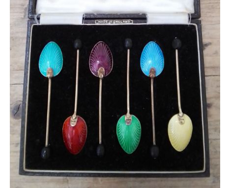 A cased set of six George VI silver gilt and enamel tea spoons, Barker Brothers Ltd, Birmingham 1949.  Condition - a few slig