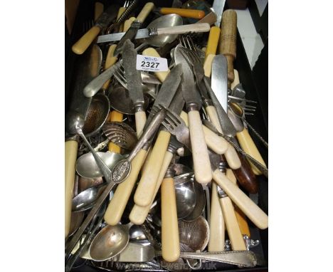 A quantity of mixed cutlery, bone handled knives, forks, fish eaters and servers (some with silver bands), teaspoons, lobster