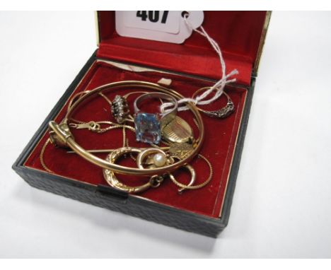 A 9ct Gold Bangle, with cat head and tail clasp; together with 9ct gold and other rings, locket pendant, etc. 