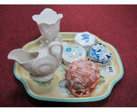 A Shell Shaped Cream Jug, together with trinket boxes, conch shell with carved cameo detail etc. 