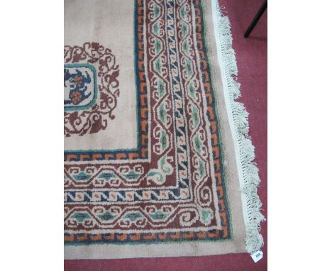 XX Century Wool Carpet, cream border and centre, circular motive, tassel ended, 404 x 311cms. 