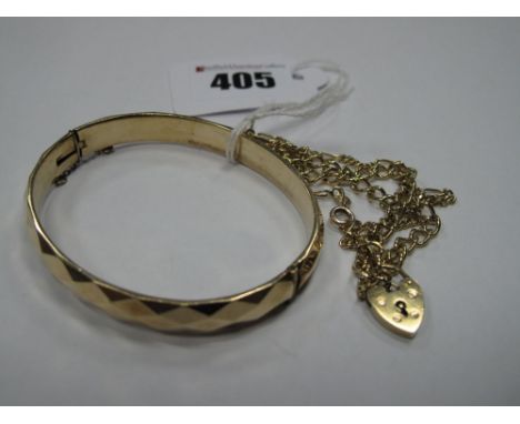 A Curb Link Bracelet, to 9ct gold heart shape padlock clasp; together with a hinged bangle and a further chain bracelet. (3) 