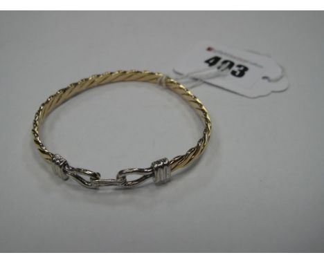 A 9ct Gold Bangle, of twisted design to hook clasp. 