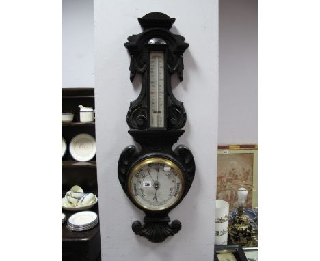 A Late XIX Century Dark Oak Barometer, cased by 'Benetfink and Ci, Cheapside, London', thermometer above and heavy carved arc