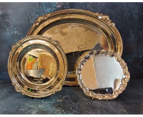 A plated oval serving dish, Mappin and Webb, 47cm wide;&nbsp; an Asprey circular dish, gadrooned and shell border, 28cm diam;