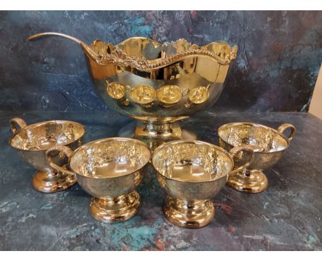 A Frank Cobb and Co Limited punch bowl, gadrooned and shell border, 25cm wide;&nbsp; four punch cups;&nbsp; a ladle&nbsp;  (V