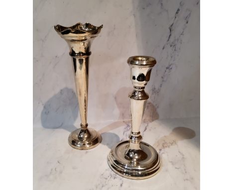 A silver table candlestick, reel shaped sconce, tapering column, dished circular base, 16.5cm high, Mappin and Webb, Birmingh