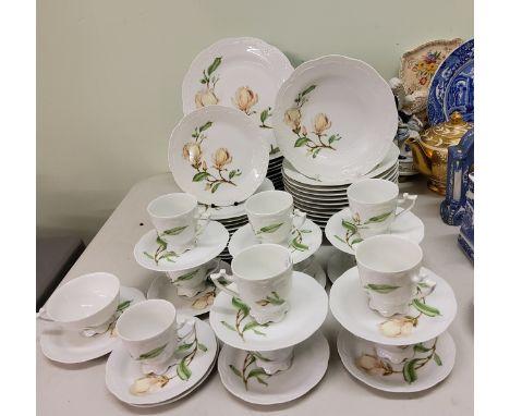 A German Hutschenreuther Victoria dinner and tea service, for twelve, each printed with magnolia flowers, printed marks 