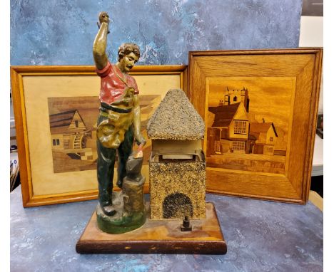 An early 20th century novelty side light, of a blacksmith at his anvil,&nbsp; rectangular base, 46cm high, c.1930;&nbsp; a ma