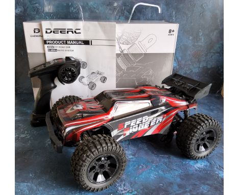 A DEERC 9206E 4WD 1:10 scale Remote Control Truck with an extra clear shell, built, with contoller in original box not tested